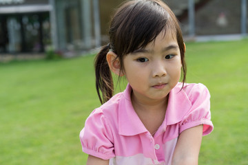 Asian cute little girl Playing the field