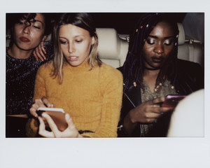 Diverse women in a backseat of a cab