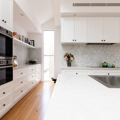 Renovated classic contemporary style kitchen in white and grey tones