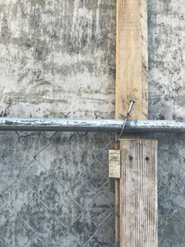 Concrete wall and chain-link fence