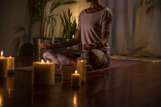 Woman peacefully meditating on a summer evening