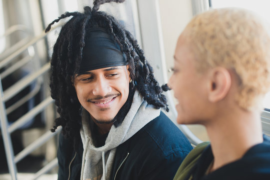 Man smiling and riding subway in the city