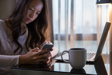 Woman typing on phone