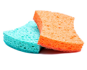 Orange and green non scratch scrubbing sponge isolated on white background