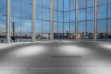 empty floor and cityscape of modern city from window.