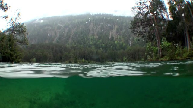 Fernsteinsee mountain lake underwater Tyrol Austria. Beautiful emerald green alpine attractions of nature of Fernpass in Nassereith.
