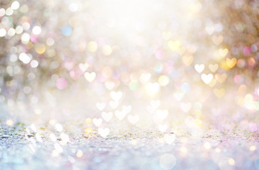 Beautiful shiny hearts and abstract lights background