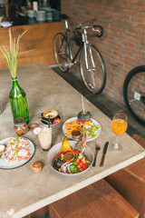 Multicolored delicious veggie dishes on the table in a cafe. Dishes only from vegetables. Healthy food