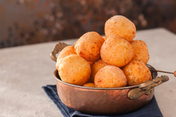Small cottage cheese doughnuts (castgnole) in a vintage bowl. Festive dessert.