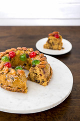 Colorful Christmas fruitcake with almonds