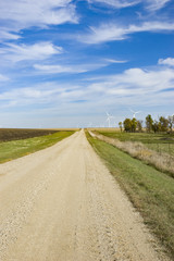 Fototapeta na wymiar Windmills and Country Road