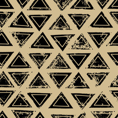 Black and beige triangles aged geometric ethnic grunge seamless pattern, vector