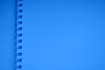 blue spiral bound notebook. Horizontal blank copybook .Template ,mock up of organizer or diary isolated.Background, texture. Notepad