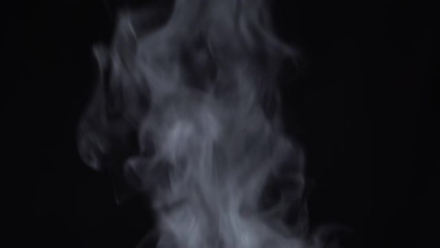 Steam rises on a black background