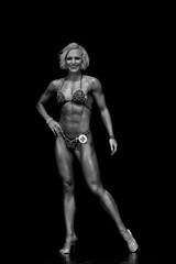 fitness model posing in competitions