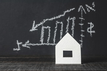 Credit, mortgage, concept. Dark background. House, chart