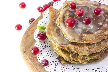 stacked small round honey pancakes