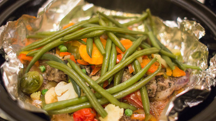 Stewed lamb with vegetables in Tajina