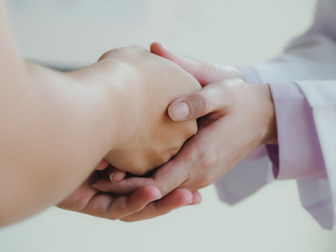 Hands in hands, helping take care concept and soft focus for background