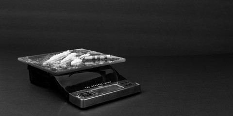 Image representing cocaine on a scale for sale and consumption