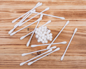 Organic double end cotton ear and make up swabs, buds on wooden vintage background