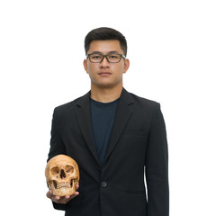 Businessman holding skull isolated on white background with clipping path