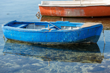 Fototapeta na wymiar Old Wooden Rowing Boat - Sicily Italy