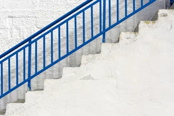 Papier Peint photo Lavable Escaliers Simply exterior with blue staircase and stone white wall in Greece
