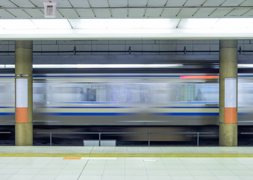 Motion blur side of high speed train in metro
