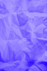 Crumpled purple paper as background