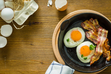 American breakfast with sunny side up eggs, bacon