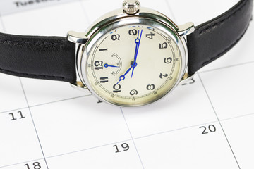 men's wrist watch and the calendar.Concept of date and time