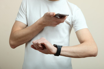 teenager with a smartphone and smart watch