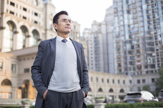 Confident businessman looking at view
