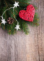 Christmas tree branches with heart decoration