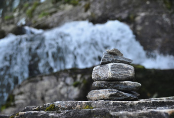 The stone stacked pyramid of desires is built on the stones of the waterfall of Twindeafessen, Norway.The symbol of faith in miracle and the fulfillment of desires. Balance, relax, calme