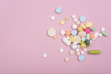 colorful medicine. Pharmacy on pink background.
