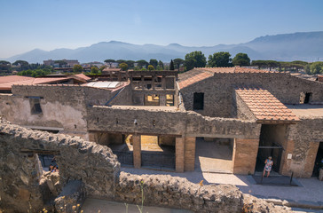 Walking around the ruins and the empty streets of the ancient antique site of Pompeii destroyed by Mount Vesuvius in AD 79, Naples, Campania, Italy, Europe