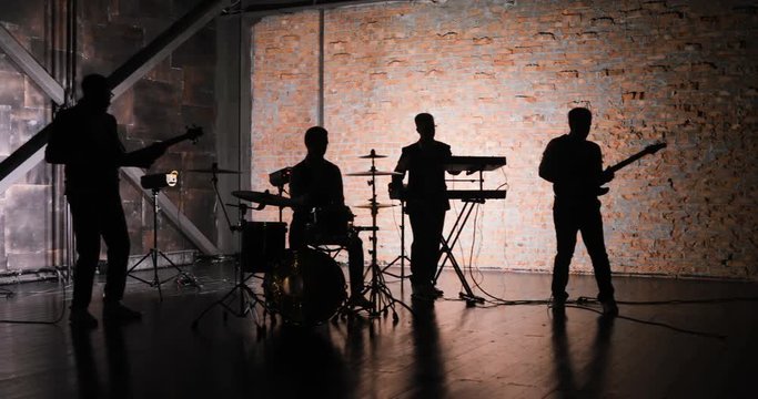 Rock music concert stage. Musical rock show. Rock music band concert. Music concert rock group. Concert musicians stage. Music band silhouette