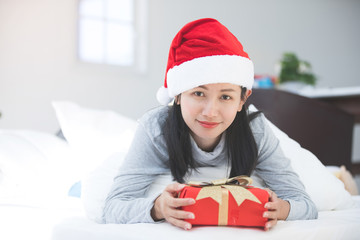 Portrait of young beautiful asian woman with christmas present boxes