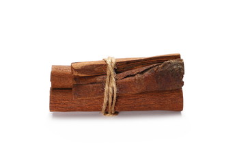 Cinnamon sticks tied together with string, spice isolated on white background