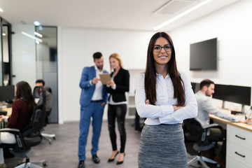 Fototapeta premium Portrait of young businesswoman posing in office