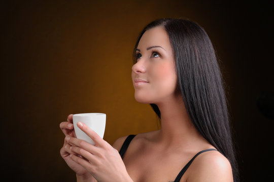 Beautiful Woman with cup of Coffee