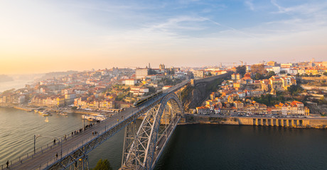 Obraz premium The oldtown skyline at Sunset from Dom Luis Bridge, Douro River, Porto, Portugal, Iberian Peninsula, Europe