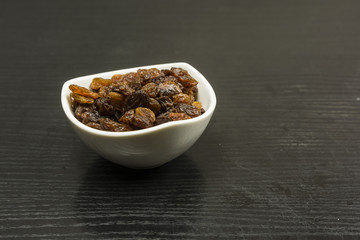 A bowl of raisins.