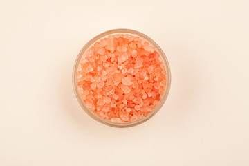 Red sea salt in glass container top view