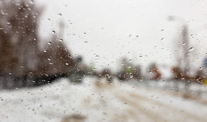 Fototapeta na wymiar Drops on the car window in winter