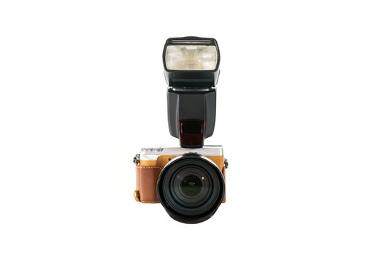 Digital SLR camera with flash isolated on white background.