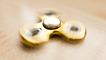 The golden spinner is spinning on the table