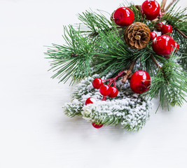 Naklejka na ściany i meble Christmas branch decoration with berries and cones on white background